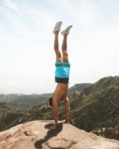 Handstand on hill top