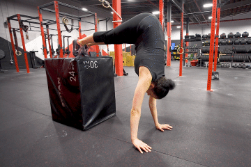Elevated pike handstand Shoulder taps